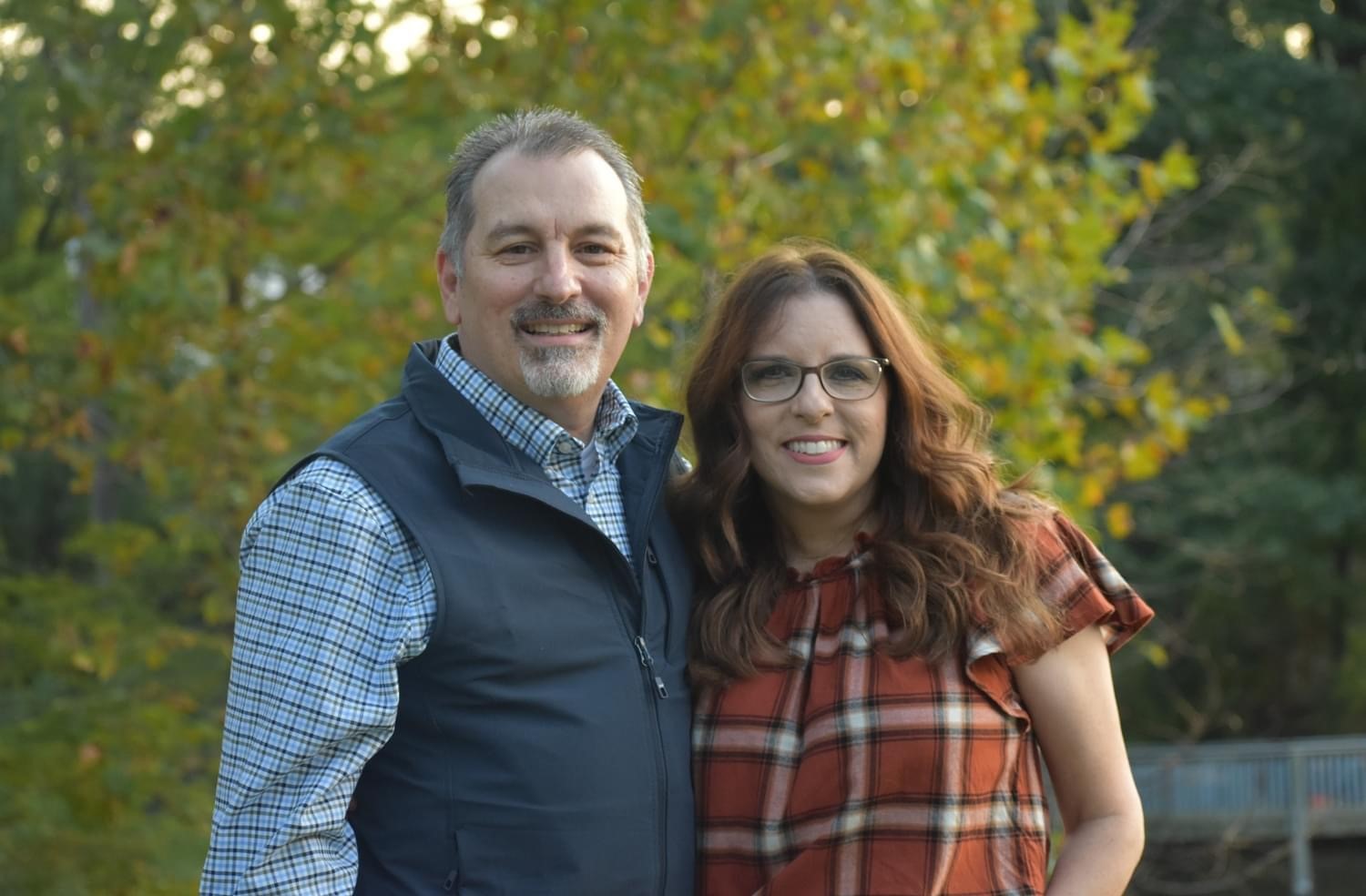 Buddy Perstrope and his wife posing and smiling at the camera