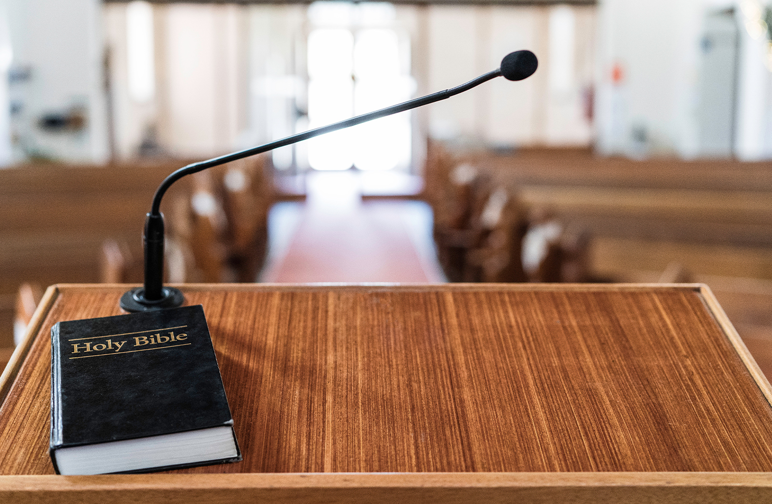 A Bible on a pulpit in a rented church building. 