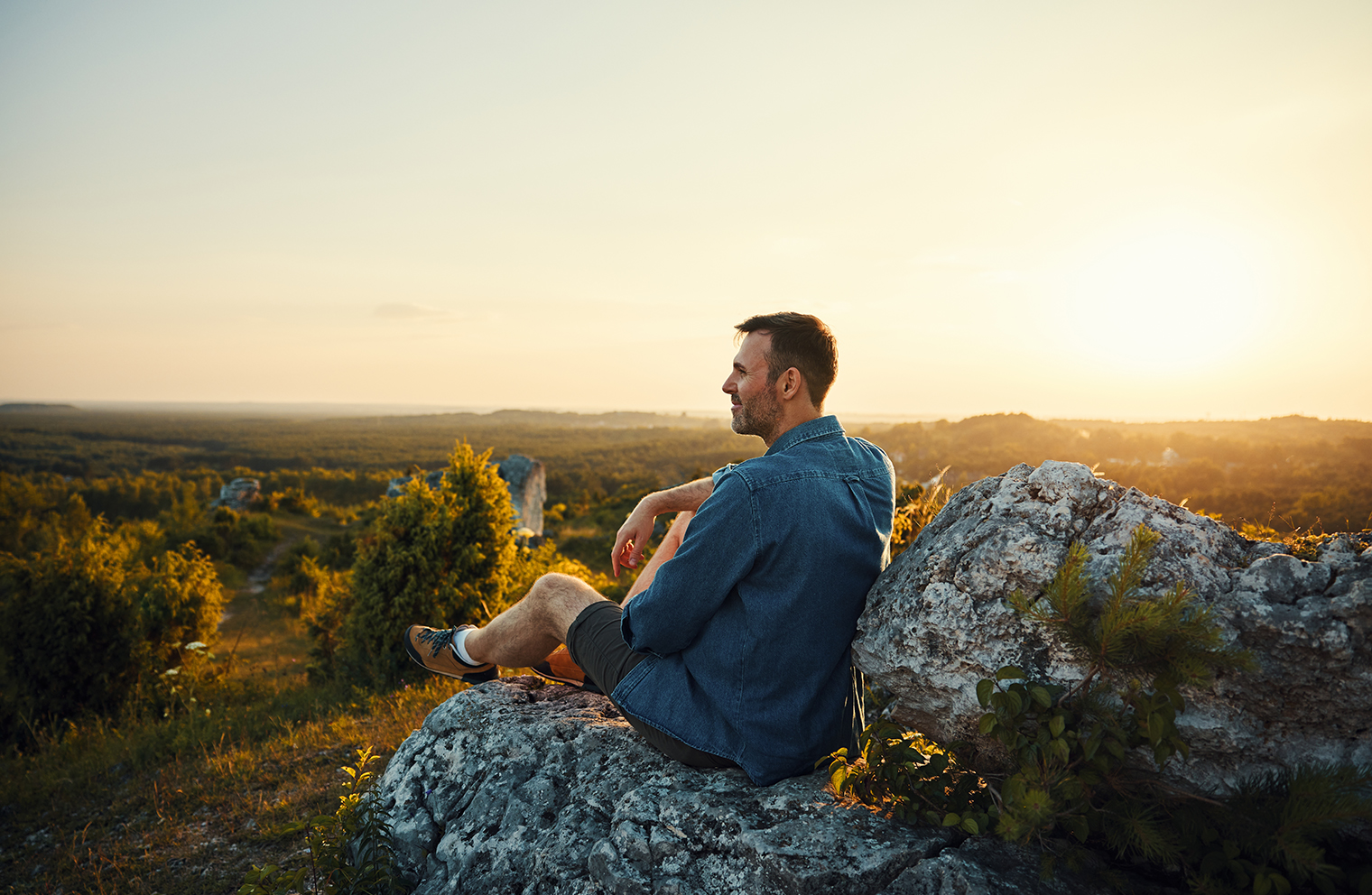 A man hikes for exercise to care for his health.