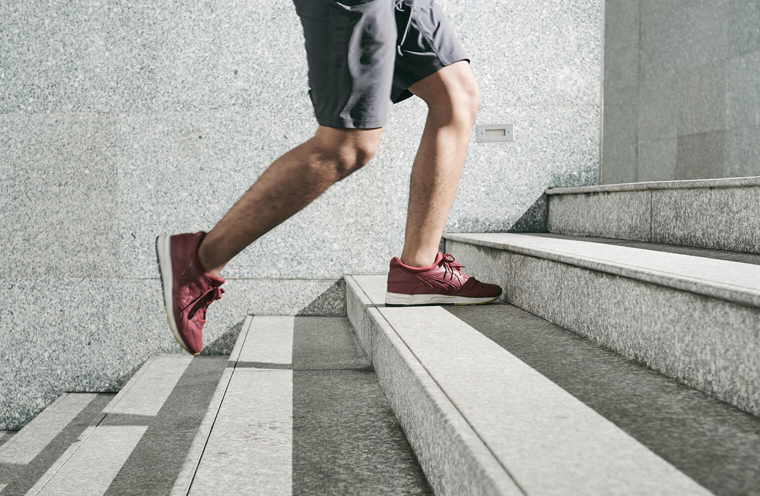 A man walks up outdoor steps for a no-cost way to exercise. 