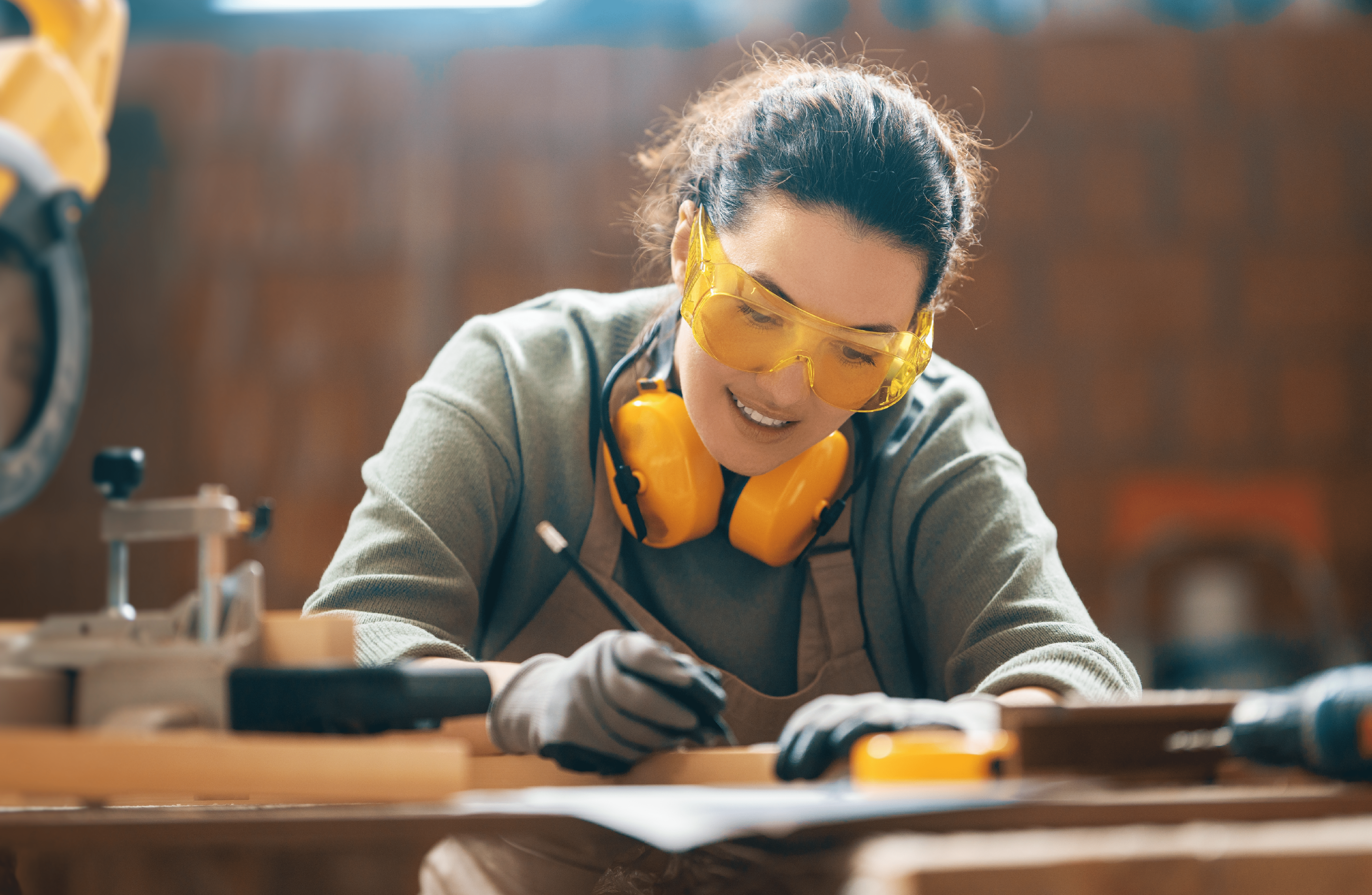 woodworker wearing eye and ear protection