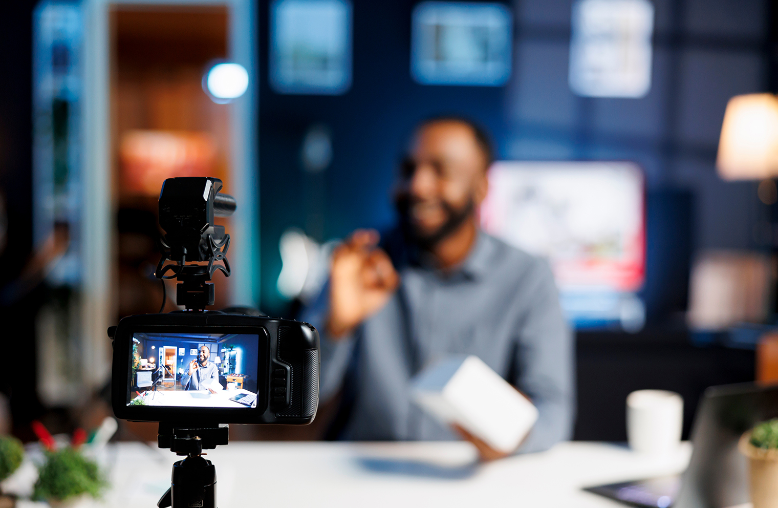 A church pastor follows a church social media policy as he records a video from his office.