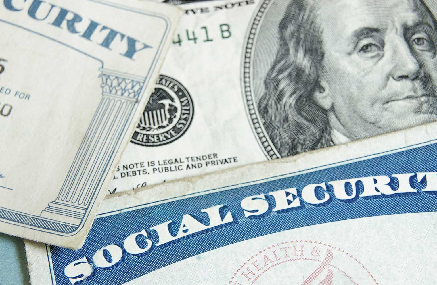 Image of a social security card and money.
