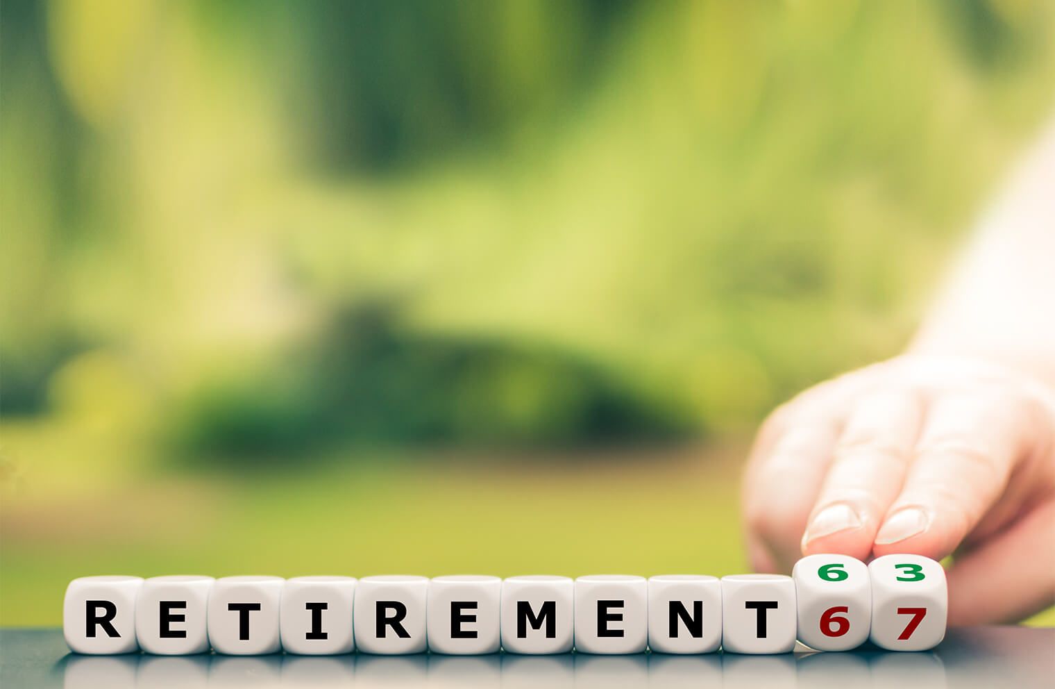 Image of scrabble letter blocks spelling out "Retirement."